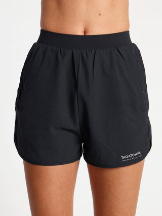 Black 2-in-1  shorts with TAGATONNA ATHLETIC DESIGN LAB logo with zip pockets on a white background