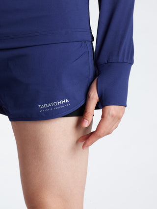 Navy Mid layer with thumbholes with 'TAGATONNA' branding